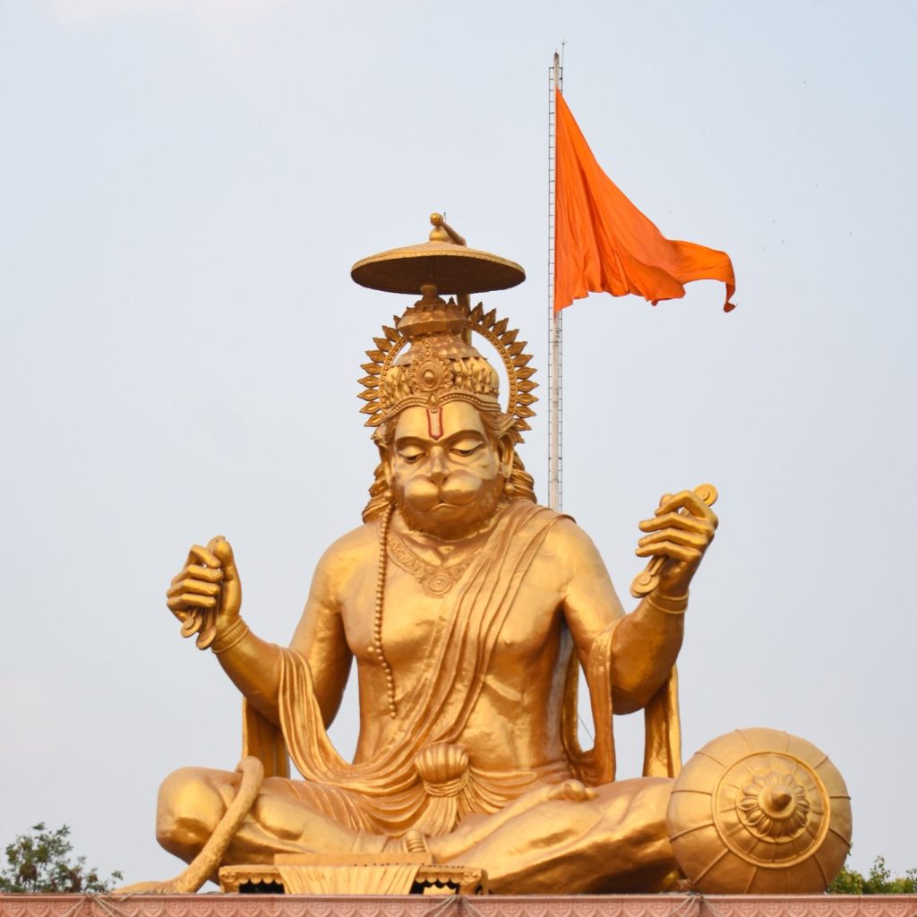 A detailed Hanuman statue in a blessing pose.
