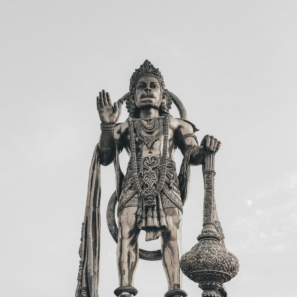 A detailed Hanuman statue in a blessing pose.
