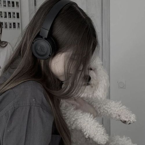 A stylish individual posing confidently in a trendy outfit, set against a chic urban backdrop.