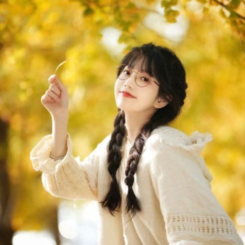 A stylish individual posing confidently in a trendy outfit, set against a chic urban backdrop.
