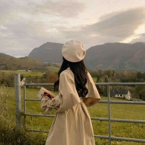 A vibrant photo of a traveler with a scenic mountain backdrop, capturing the essence of adventure and wanderlust.