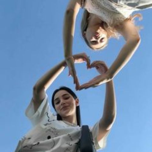 A group of friends enjoying a fun moment together, laughing and posing for the camera.