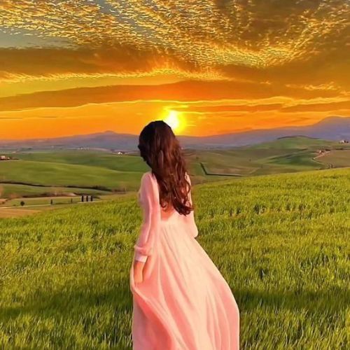 A girl standing in soft sunlight, her face glowing with warmth and serenity, creating a dreamy and peaceful atmosphere.