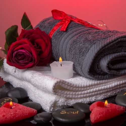 A black background featuring neatly arranged towels