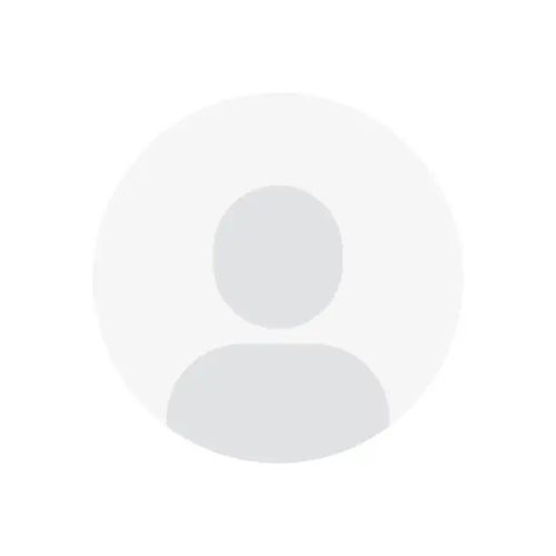 A person is centered in a circular frame against a plain white background