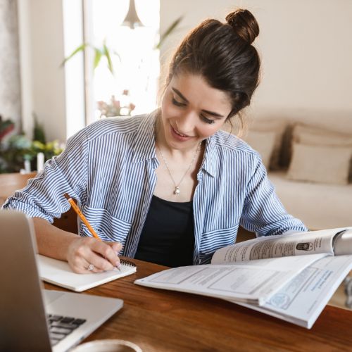 A woman is studying at home