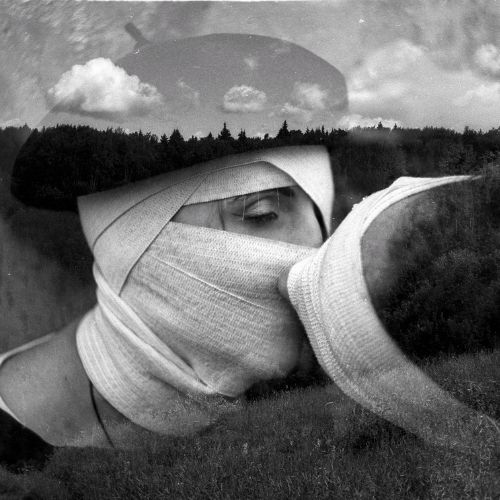 A man and woman both have bandages covering their facesA man and woman both have bandages covering their faces