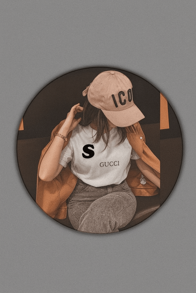 A woman wearing a hat featuring the letter 'S' logo prominently displayed on the front